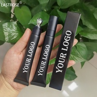 Huile à lèvres noire en tube, très vendue, avec applicateur de massage métallique pour repulper les lèvres, produit de soin des lèvres hydratant à marque privée
