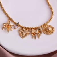 Style de vacances pour femmes géométrie irrégulière amour arc coquille laiton plaqué or pendentif chaînes classiques présentant un charme de personnalité