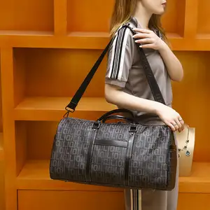 Neuzugang individuelles Logo Luxus schwarze Designer-Duffeltasche Ledertaschen Herren Wochenende Sport Übernachtung Gepäck Reisetasche