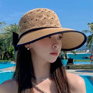 Chapeau de soleil pliable en paille tressée avec nœud ajouré pour femme – Vente en gros - Product Image 3