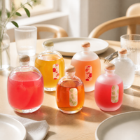 Bouteille à spiritueux ovale en verre borosilicate, forme galet, luxe unique, pour gin et whisky, base lourde avec sérigraphie intégrée