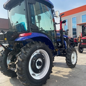 Tracteur à roues 4x4 bleu, moteur diesel, transmission par engrenages, haute productivité, équipement agricole, démarrage électrique - Product Image 1