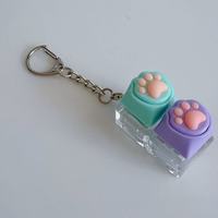 Porte-clés anti-stress à double patte de chat avec interrupteur mécanique pour clavier, jouet mignon, cadeau de Noël, de bureau ou de fête