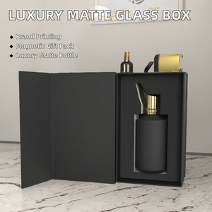 Flacon de parfum en verre givré noir vide personnalisé avec bouchon doré et boîte magnétique, et crème de soin imprimée avec logos - Product Image 1