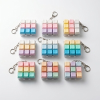 En gros, Porte-clés anti-stress en plastique, lumineux et étanche, avec 9 boutons colorés, design axe et touches carrées, jouet sensoriel Fidget Tide Toys