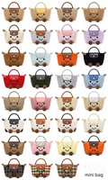 Sac à main en peluche avec visage souriant personnalisé en usine, nouveau modèle d'hiver, mini portefeuille de Noël