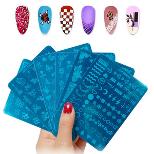 Nuevas 14 Placas de Estampado de Uñas con Diseños de Arte, Rosas, Flores, Mariposas, Calaveras y Totems, Placas Grandes de Metal para Estampado de Uñas - Product Image 1