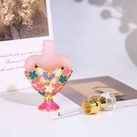 Flacon vide en verre pour huiles essentielles et parfums de voyage, en forme de cœur, avec texture givrée, motif papillon et fleur émaillés