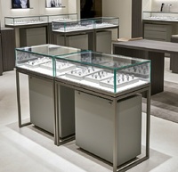 Comptoir de présentation de bijoux de luxe moderne sur mesure, vitrine haut de gamme en acier inoxydable brossé et verre pour boutique de bijoux et montres en centre commercial