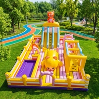 Château gonflable géant pour enfants, trampoline extérieur avec toboggan, lit de saut gonflable, idéal pour la location d'événements et les activités en plein air.