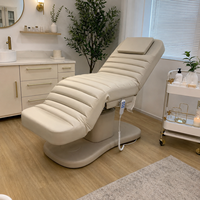 Lit de beauté facial moderne en PVC avec mécanisme de levage électrique, 3 moteurs, design pliable pour usage en salon