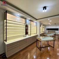 Meubles de présentation complets pour magasin d'optique sur mesure, étagères murales pour lunettes avec éclairage LED, armoire avec comptoir d'exposition en verre