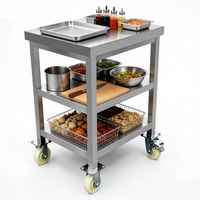 Banc de travail mobile robuste à 2 niveaux en acier inoxydable poli, table de préparation amovible avec roulettes pour hôtels, restaurants et services de traiteur