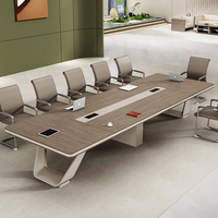 Bureau de salle de réunion d'entreprise avec plateau arrondi, module de câblage encastré et options de couleurs flexibles