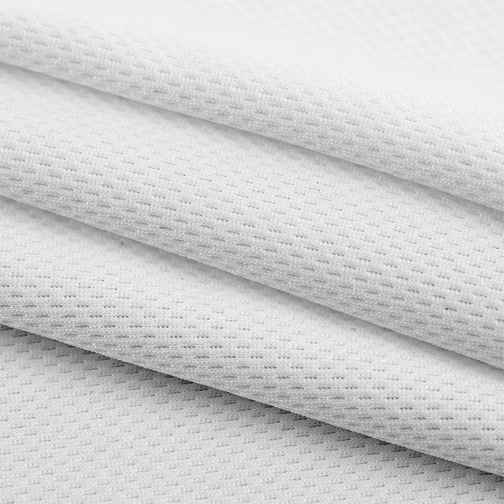 Tissu tricoté en maille interlock respirant et extensible en polyester 100% pour t-shirts