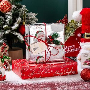 Papel de regalo navideño de aluminio con un patrón de cabeza de Papá Noel plateado, impreso por ambos lados con palabras, personalizable. - Product Image 1