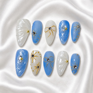 Faux ongles en amande faits main, 10 pièces, avec nœud bleu gelée, perle et rayons dorés, à presser, pour mariée - Product Image 1