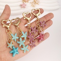 Nouveau porte-clés créatif en alliage de zinc, pendentif étoile de mer coloré, fermoir en forme de cœur, petit cadeau pour femme