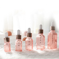 Flacon compte-gouttes rose vide et transparent de 20ml pour huile de pilosité faciale de conception personnalisée d'essence de verre d'huile essentielle à pompe liquide