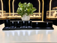 Boîte à bijoux LED noire en gros pour bagues, boucles d'oreilles, pendentifs, bracelets et ensembles de bijoux pour diamants