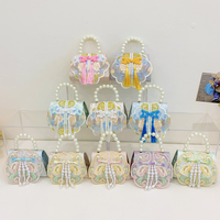 Sac bandoulière brodé style chinois pour filles, avec poignée en perles et pompon, idéal pour les fêtes et l'usage quotidien des tout-petits - Vente en gros