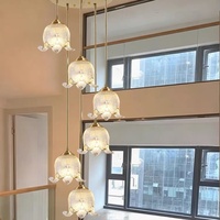 Lustre en cuivre et cristal multi-têtes pour salle à manger et bar, suspension en verre exquise pour café et salon à plafond haut