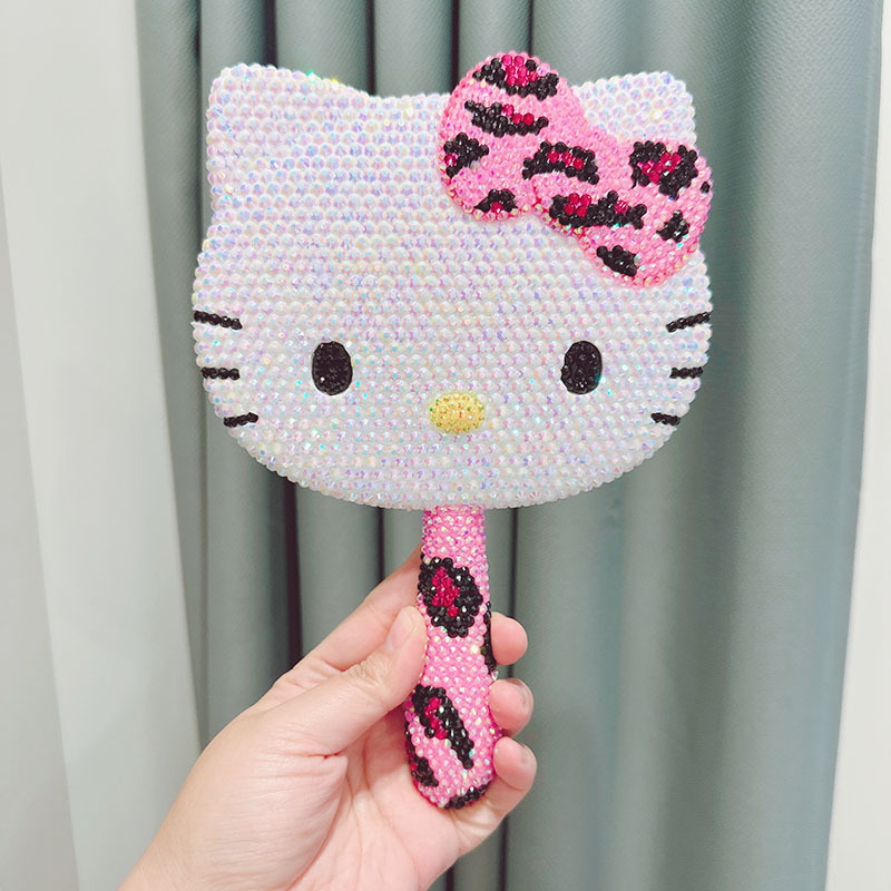 Specchio con manico con stampa leopardata rosa