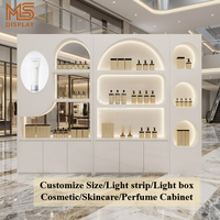 Vitrine murale moderne en MDF éclairée par LED pour produits cosmétiques, parfums et soins de beauté, présentoir de vente au détail pour salons de beauté