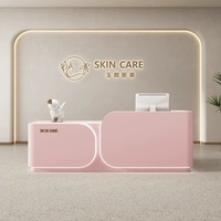 Table d'accueil rose moderne de luxe pour salon de beauté, en bois doré, avec design durable, idéale pour supermarchés et hôpitaux
