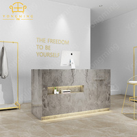 Meuble de réception de beauté moderne multifonctionnel en marbre de haute qualité et bon marché pour salon