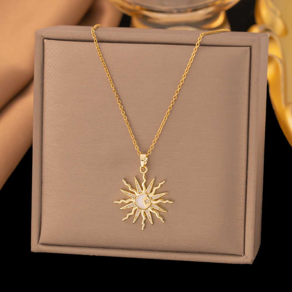 Diamond star and sun pendant on stainless steel necklace