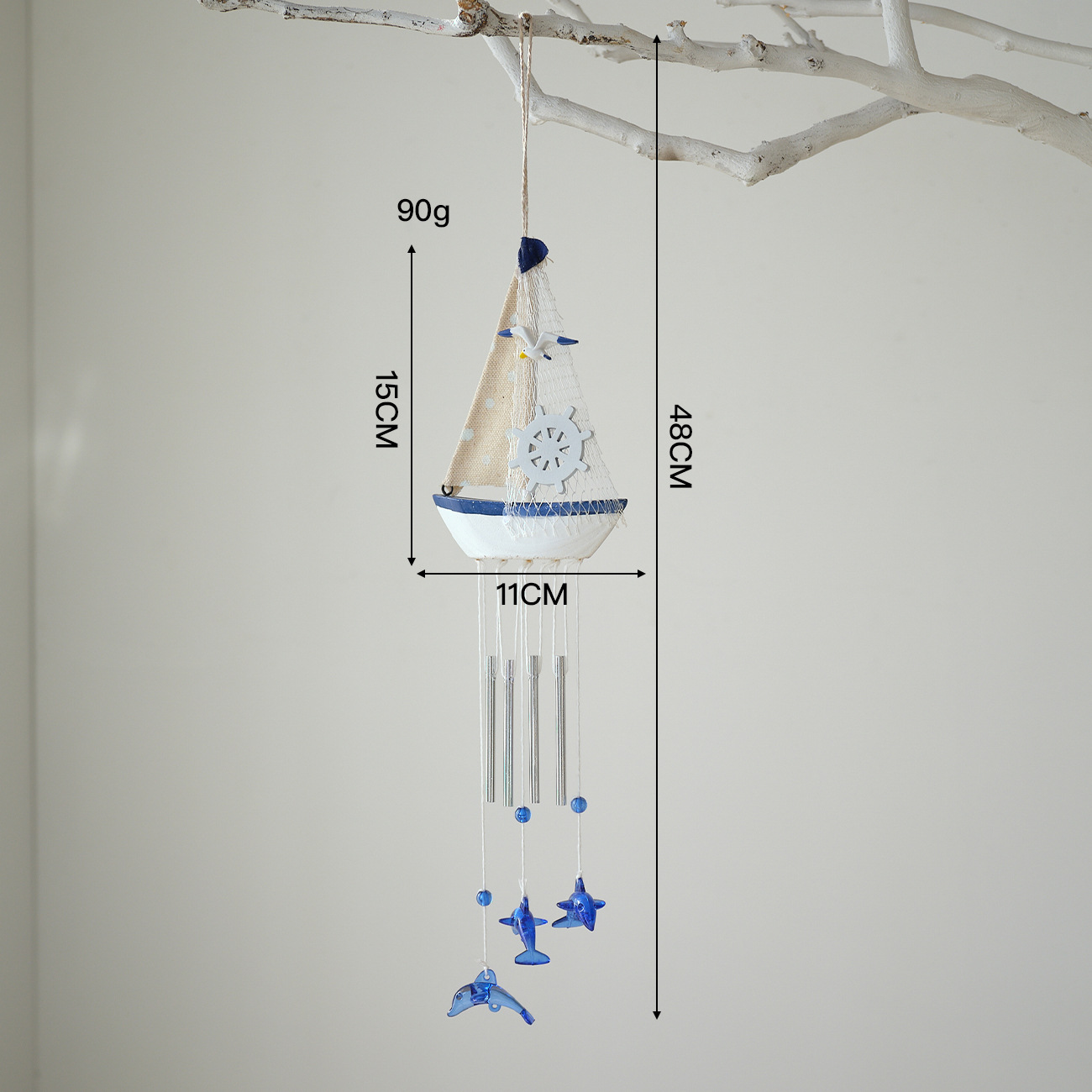 Blue and white wind chimes with white fabric