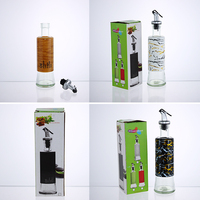 Bouteille Distributrice d'Huile en Verre 300ml avec Bec Verseur en Acier Inoxydable et Coque Décorative en Plastique – Idéale pour l'Huile d'Olive et le Vinaigre en Cuisine et à la Maison