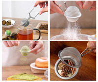 Infuseur à thé réutilisable en acier inoxydable 304 avec tige poussoir, filtre à thé en forme de boule à long manche, maille fine, moderne, pour vente en gros