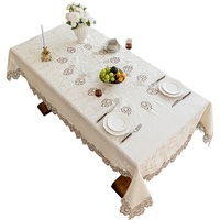 Nappe rectangulaire pour six personnes en fibre chimique soluble dans l'eau, motif floral et bordure en dentelle