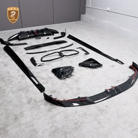 Kit de carrocería de fibra de carbono seca estilo SQ para BMW X6M F96: Labio delantero, rejillas de ventilación OEM, faldones laterales, difusor trasero, alerón de techo y molduras de guardabarros.