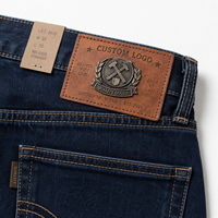Nouveau design personnalisé en creux étiquette de patch de vêtements en faux cuir PU avec logo en métal 3D personnalisé