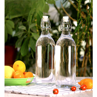 Vente en gros du fabricant Bouteilles d'eau transparentes de 750ml 1000ml à couvercle rabattable avec bouchon hermétique