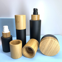 Set Kemasan Kosmetik Kaca Hitam Kustom dengan Tutup Bambu untuk Botol dan Stoples Perjalanan Label Pribadi Perawatan Kulit
