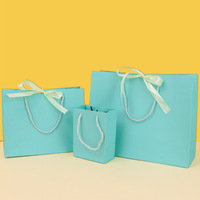 Bolsa de papel de embalaje de regalo de compras laminada impresa personalizada con su propio logotipo
