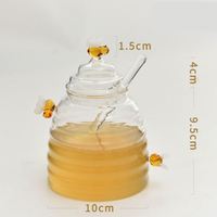 Pot à miel en verre transparent personnalisé, usage classique en cuisine, OEM/ODM disponible, couvercle multifonctionnel, design pour la préservation de la fraîcheur au quotidien