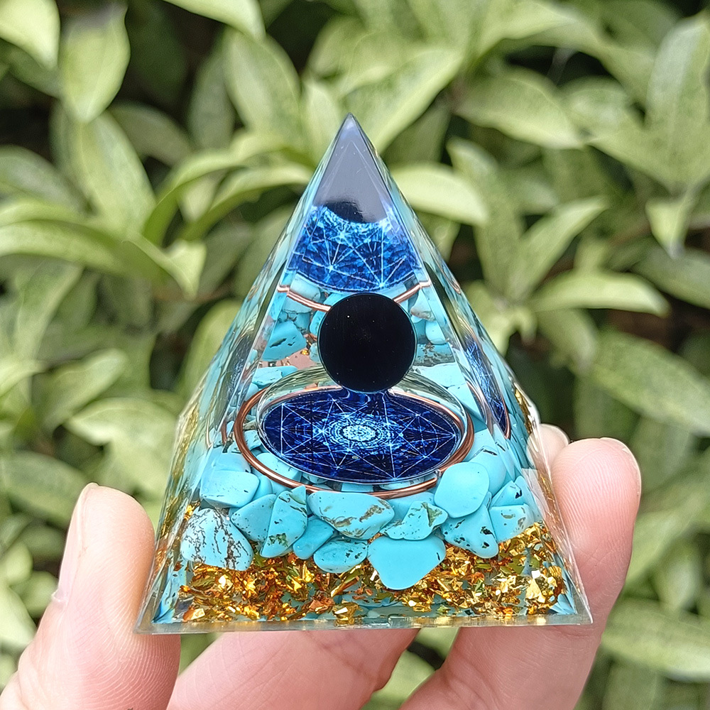 Sphère noire avec motif turquoise à six branches