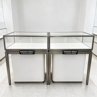 Vitrine de présentation de bijoux de luxe, cadre en acier inoxydable couleur or champagne, dessus en verre, intérieur en velours turquoise, éclairage LED, tiroir de rangement