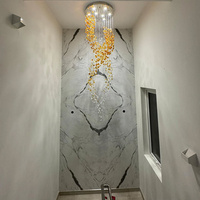 Lustre en verre et pierre irrégulière de style art moderne, suspension longue en spirale pour la décoration des escaliers de villa et des plafonds hauts