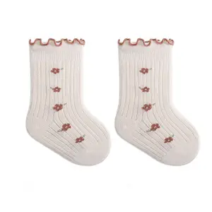 Vente en gros de chaussettes tubulaires en maille de coton rose dessin animé jacquard pour nouveau-né jeune enfant