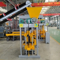 Machine à fabriquer des briques QTJ4-40A Eco, contrôlée par PLC, à moteur hydraulique, pour blocs de construction emboîtables haute densité