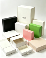 Boîte en carton personnalisée pour vêtements, rose, ondulée, pour petites entreprises, vente en gros, emballage d'expédition recyclable, boîte cadeau de luxe personnalisée