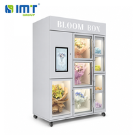 Vitrine de présentation de bouquets blanc-gris avec compartiments en verre et écran tactile pour distributeur automatique de fleurs