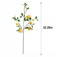 Kunstmatige citroentak met nepfruit en groene bladeren voor bloemstukken, huisdecoratie en tafeldecoratie