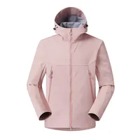 Veste à capuche en softshell orange brûlé, fermetures éclair assorties et capuche doublée grise, poches verticales zippées, vêtements techniques d'extérieur en gros